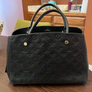 Gorgeous black monogram Louis Vuitton empreinte montaigne MM bag